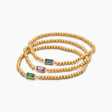 Golden beaded bracelet with a birthstone