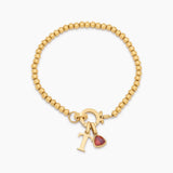 Beaded bracelet with birthstone and initial pendant