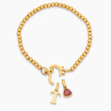 Beaded bracelet with birthstone and initial pendant