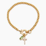 Beaded bracelet with a birthstone and a cross pendant