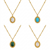 Gold vintage necklace with a green stone