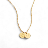 Delicate necklace with a disk bearing initials