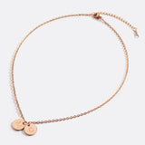 Delicate necklace with a disk bearing initials