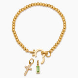 Beaded bracelet with a birthstone and a cross pendant