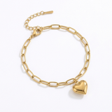 Gold paperclip bracelet with a heart-shaped pendant