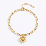 Gold paperclip bracelet with a heart-shaped pendant