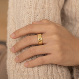 Domed ring with a ribbed texture