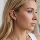 Gold-plated hoop earrings with a crystal