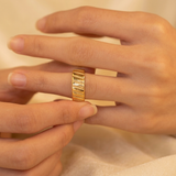 Domed ring with a ribbed texture