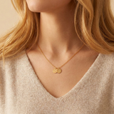 Delicate necklace with a disk bearing initials