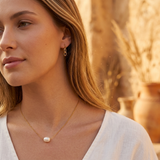 Gold choker with a freshwater pearl