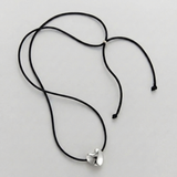 Cord necklace with a bubble heart-shaped pendant