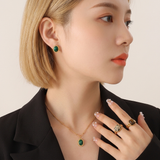 Gold vintage necklace with a green stone